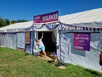 iThinc welfare tent and a volunteer